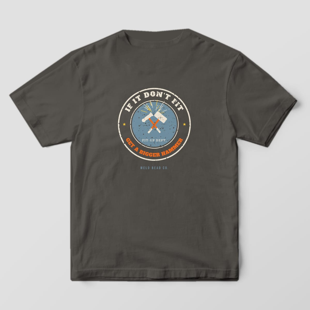 Back print on a Pepper Comfort Colors 1717 tee: Round distressed badge with crossed sledgehammers and sparks, "If It Don't Fit" above and "Get a Bigger Hammer" below