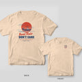 Back and front of an ivory Comfort Colors T-shirt with a center console boat speeding across a striped red sunset with wind lines and the words Boat Hair Don't Care; small chest print on the front