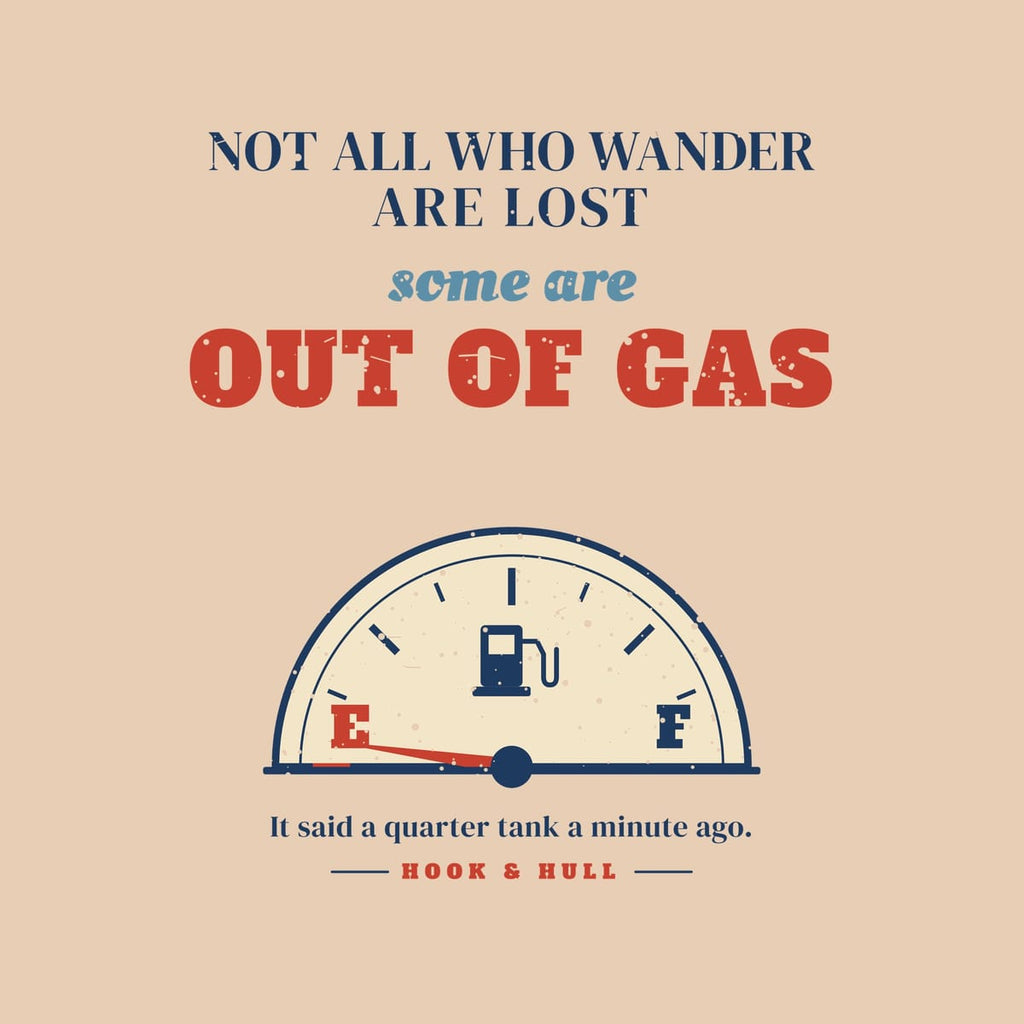 Close-up of the back print artwork on an ivory background: vintage fuel gauge with the needle on empty under the words Not All Who Wander Are Lost, Some Are Out of Gas