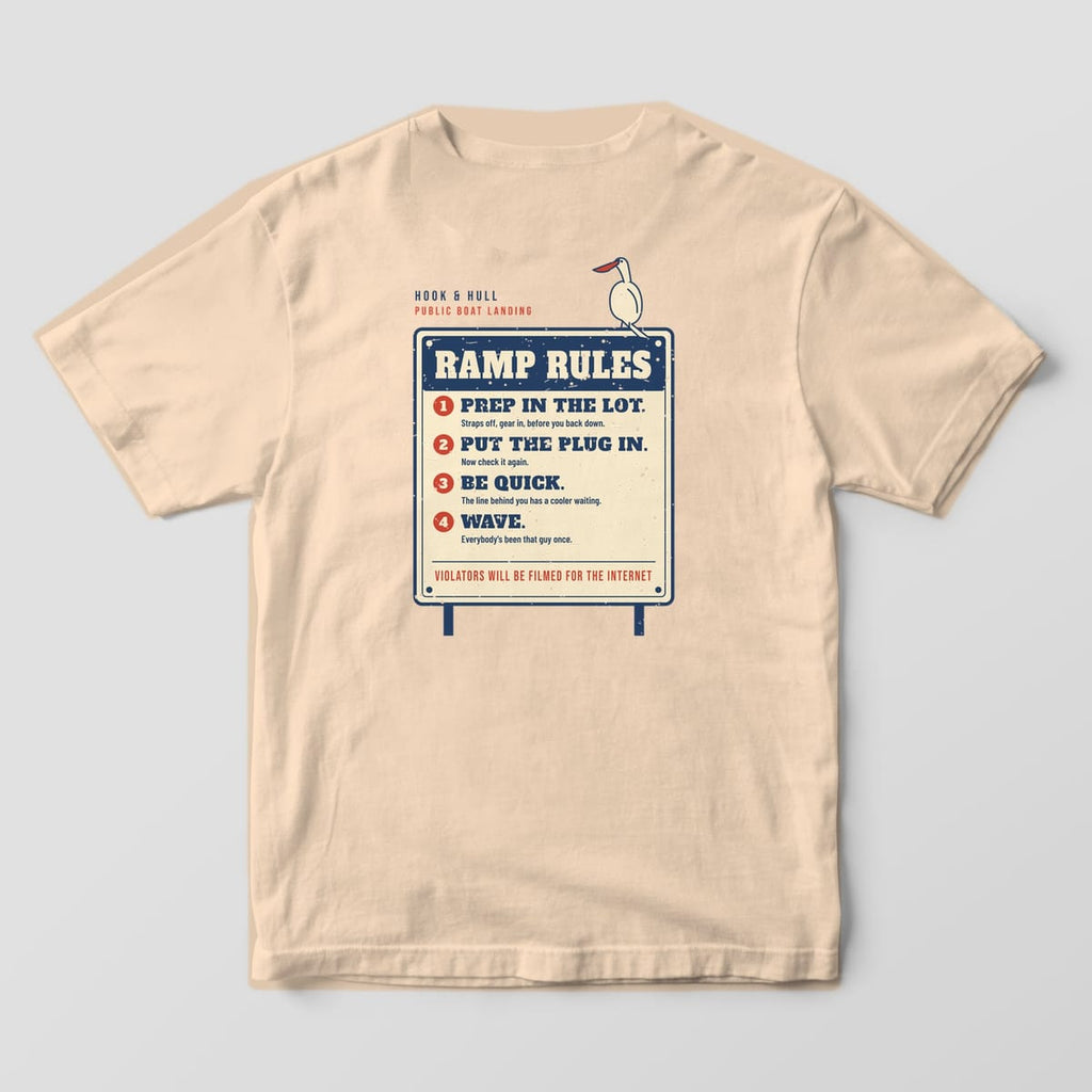 Back of an ivory Comfort Colors 1717 T-shirt showing the boat landing sign reading Ramp Rules with four numbered rules and a pelican perched on the corner