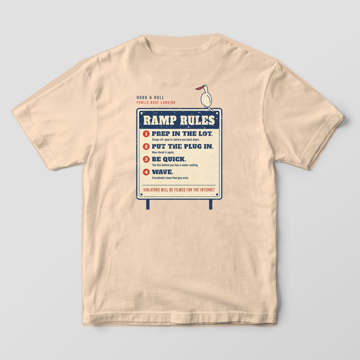 Back of an ivory Comfort Colors 1717 T-shirt showing the boat landing sign reading Ramp Rules with four numbered rules and a pelican perched on the corner