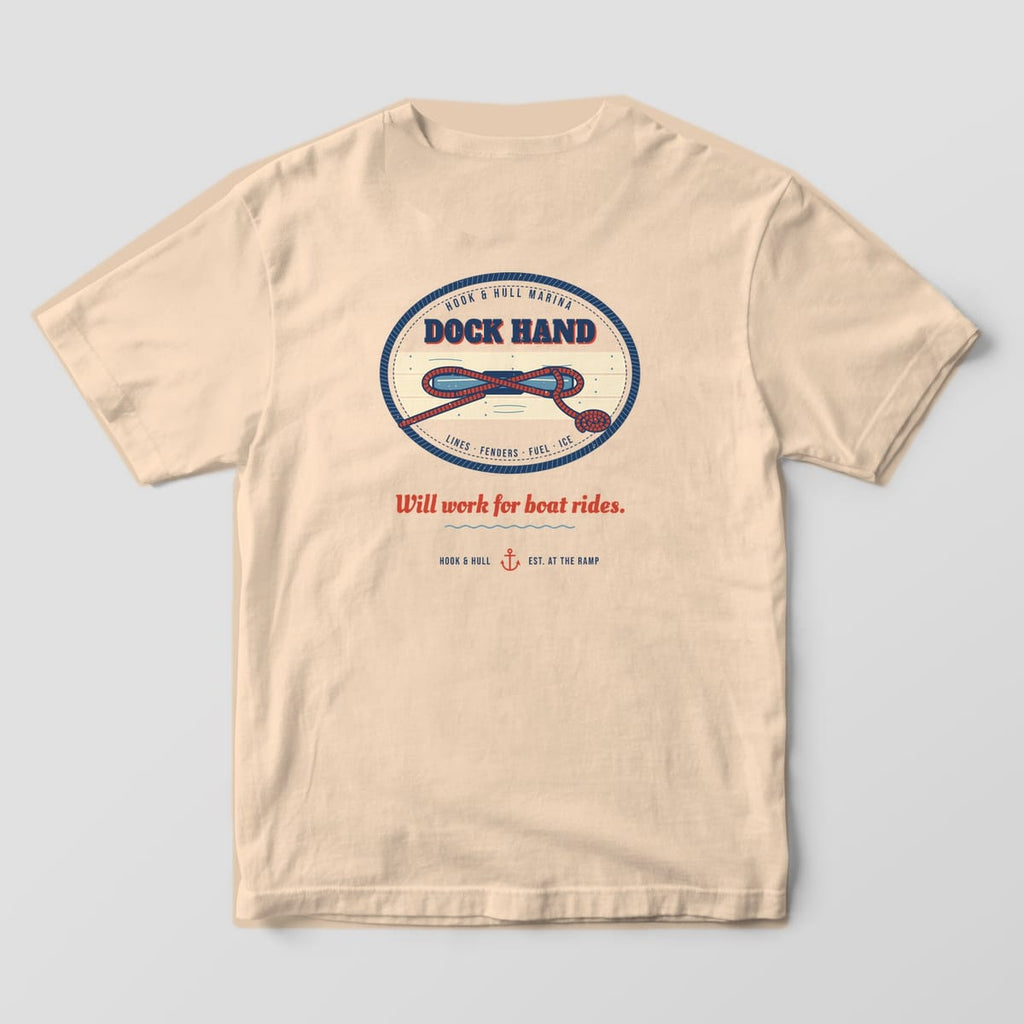 Back of an ivory Comfort Colors 1717 T-shirt showing an oval Dock Hand patch with a rope tied in a cleat hitch on dock planks and the line Will work for boat rides