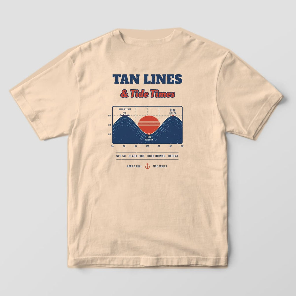 Back of an ivory Comfort Colors 1717 T-shirt showing the words Tan Lines and Tide Times over a retro tide chart with a red sunset, wave curves and a small boat