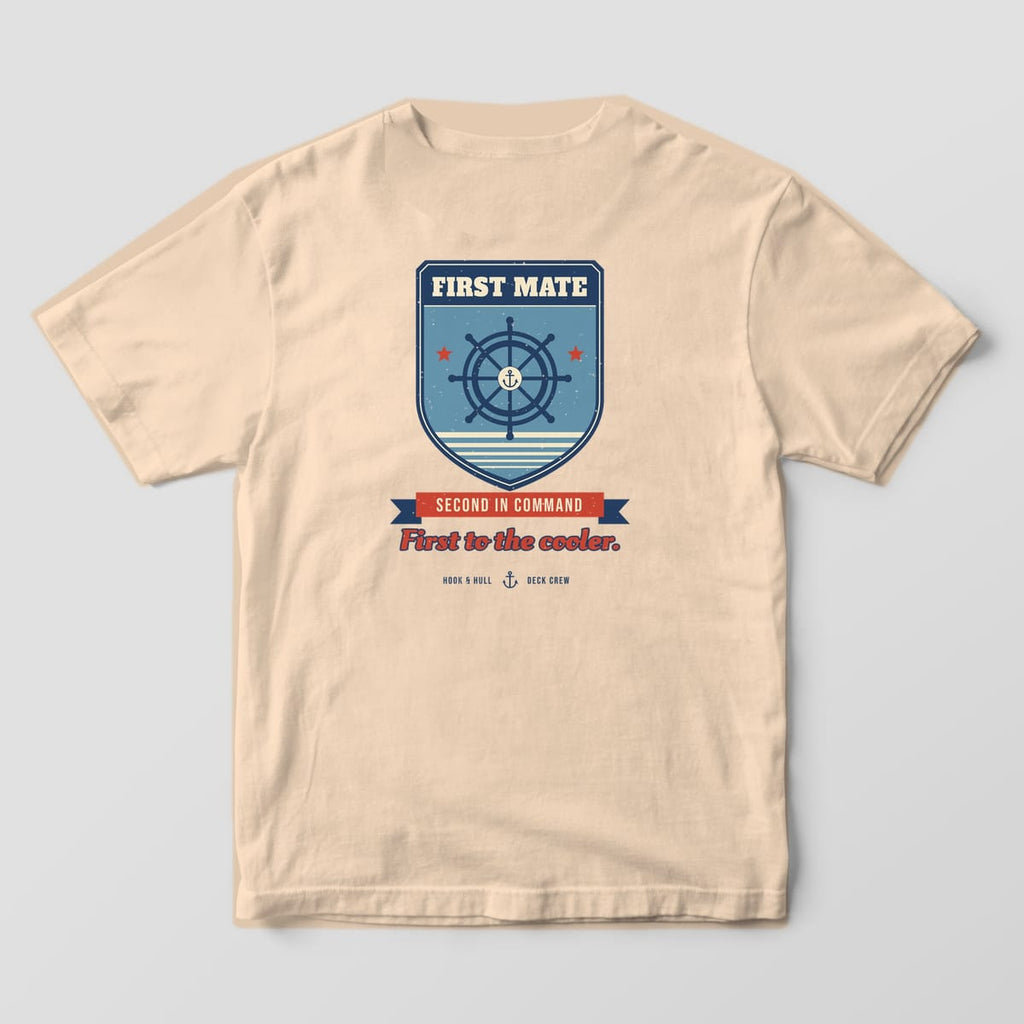 Back of an ivory Comfort Colors 1717 T-shirt showing a shield badge with a ship's wheel, the words First Mate, a Second in Command ribbon and the line First to the cooler