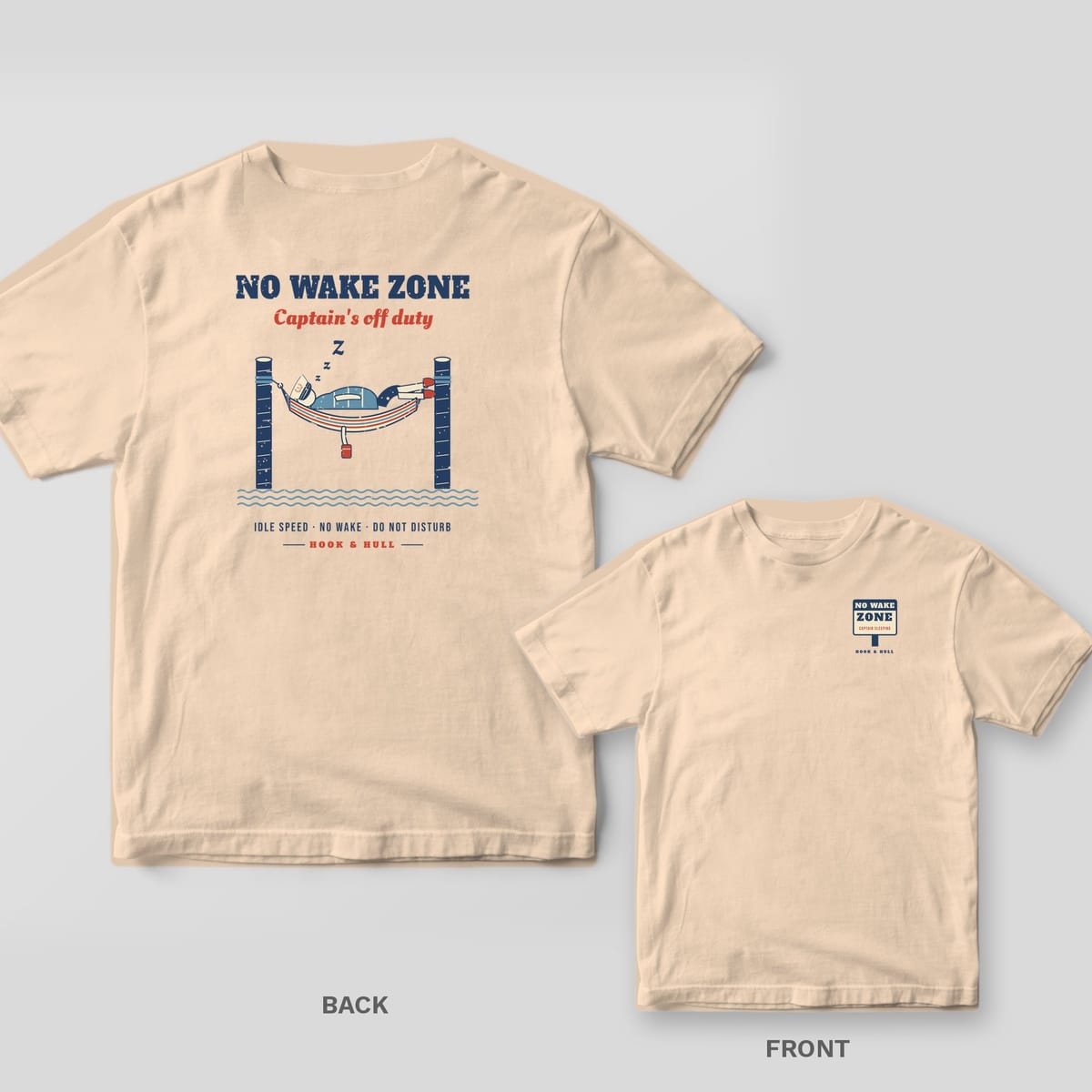 Back and front of an ivory Comfort Colors T-shirt with a captain napping in a striped hammock between two dock pilings under the words No Wake Zone, Captain's off duty; small chest print on the front