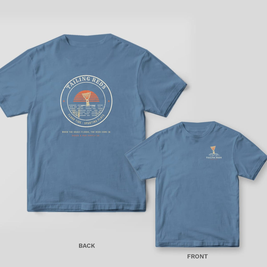 Back and front of a blue jean Comfort Colors tee with a round redfish tail badge and coral sunset