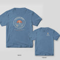 Back and front of a blue jean Comfort Colors tee with a round redfish tail badge and coral sunset