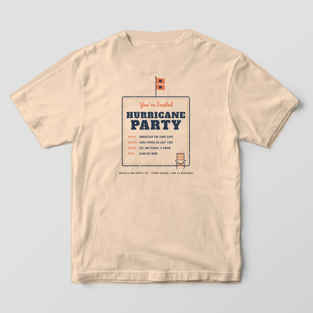 Back of an ivory Comfort Colors 1717 tee with a Hurricane Party invitation card, flag and lawn chair