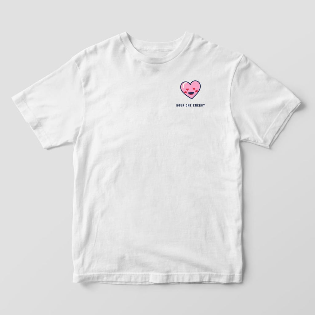 Front of a white Comfort Colors 1717 tee with a small heart-eyed smiley heart and Hour One Energy on the left chest