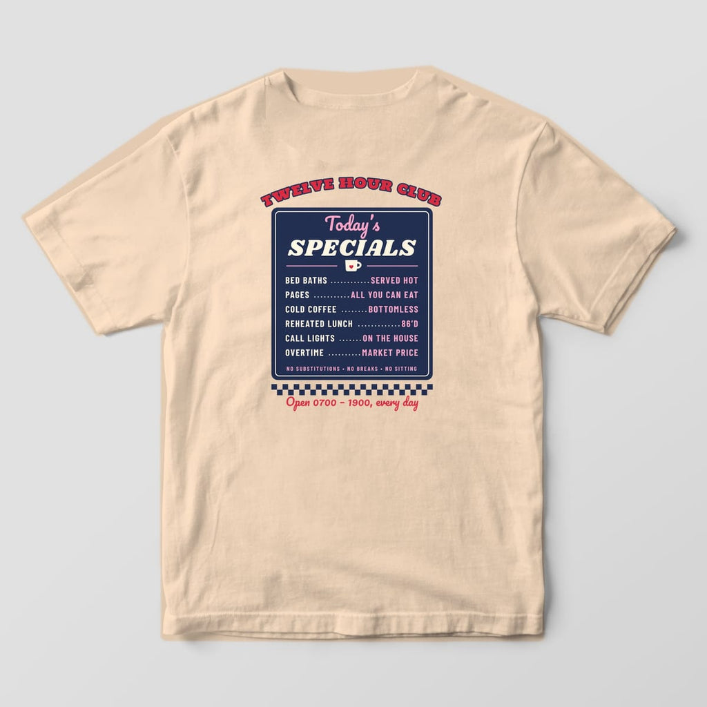 Back of an ivory Comfort Colors 1717 tee with a navy diner menu board listing Today's Specials like bed baths, pages and cold coffee