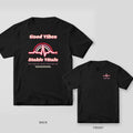 Black Comfort Colors tee shown back and front: groovy Good Vibes Stable Vitals rainbow heartbeat back print and a small heartbeat on the left chest
