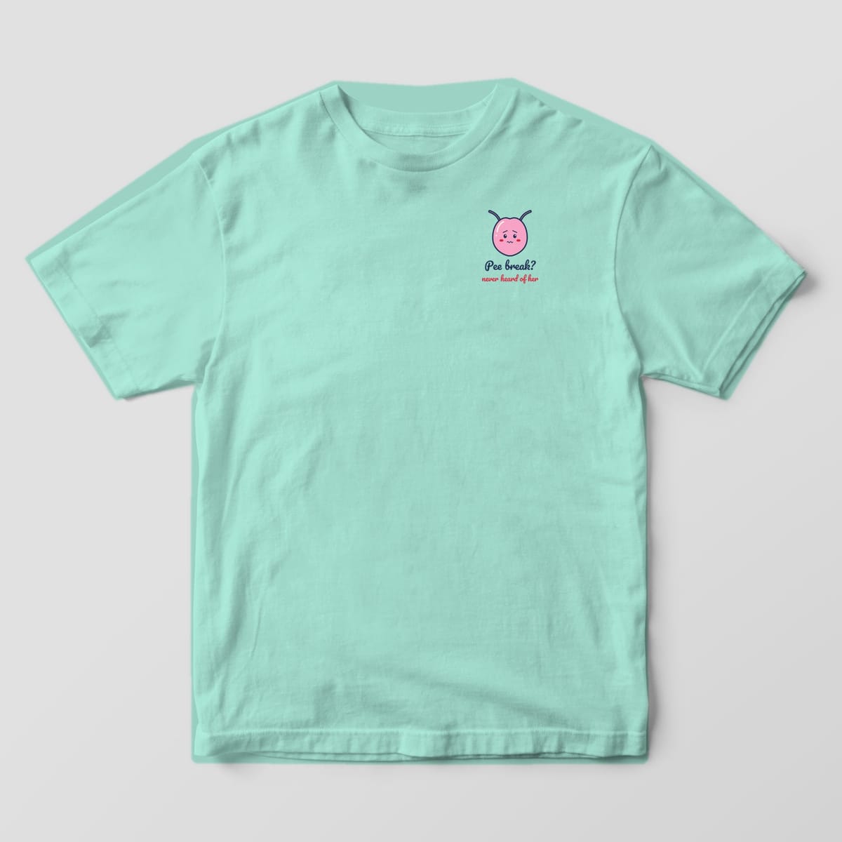 Front of a chalky mint Comfort Colors 1717 tee with a small bladder and Pee break never heard of her on the left chest