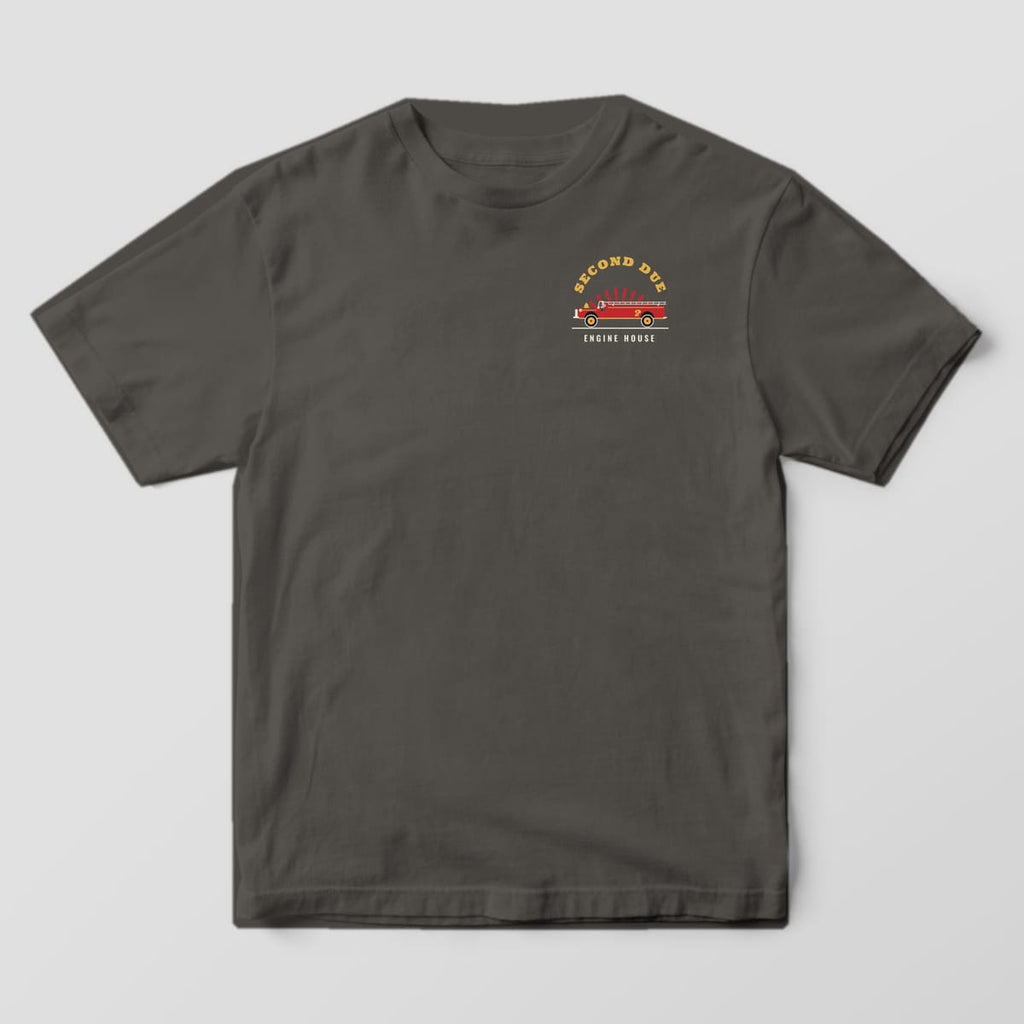 Front of a pepper Comfort Colors tee with a small Second Due engine badge on the left chest