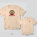 Ivory tee with a round badge showing a haloed red fire hydrant and a Find the Plug banner on the back, small hydrant on the front chest
