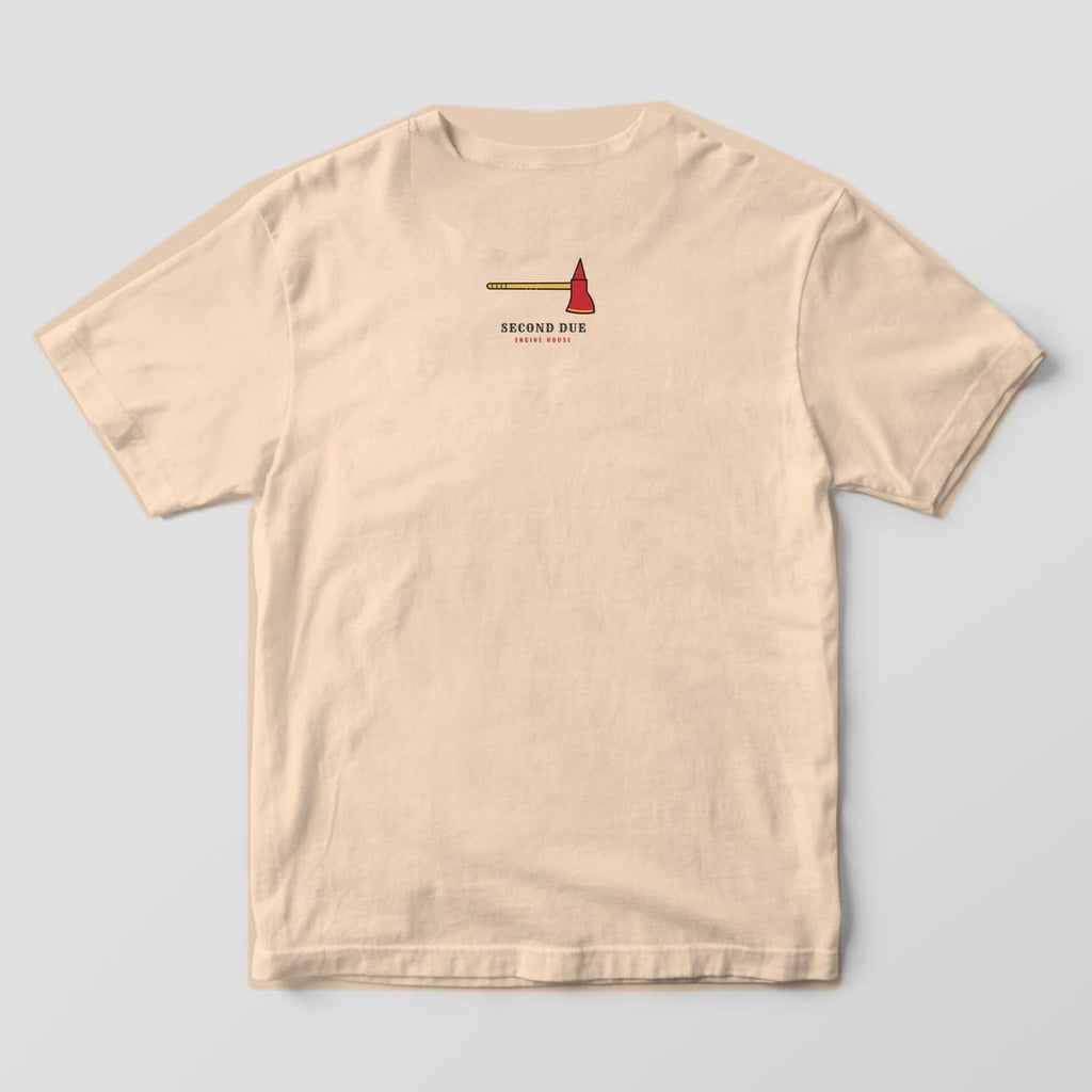 Upper back of an ivory Comfort Colors tee with a small red fire axe and Second Due Engine House text