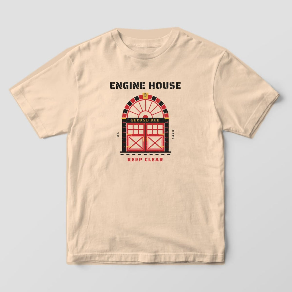Front of an ivory Comfort Colors tee with a large print of an arched firehouse door under Engine House stencil lettering