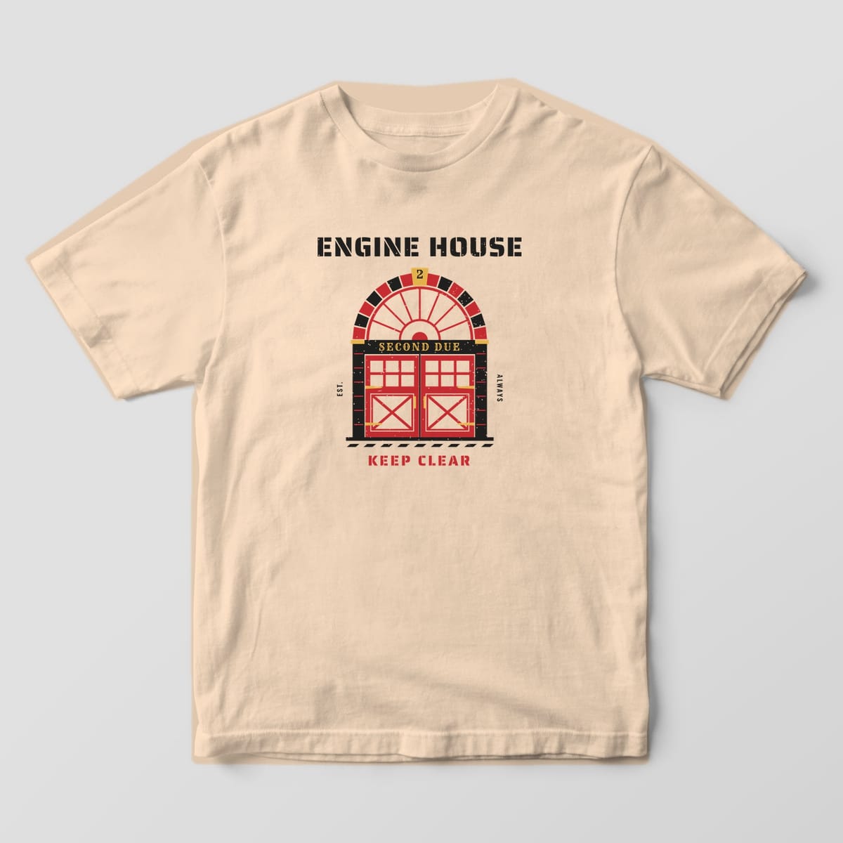 Front of an ivory Comfort Colors tee with a large print of an arched firehouse door under Engine House stencil lettering