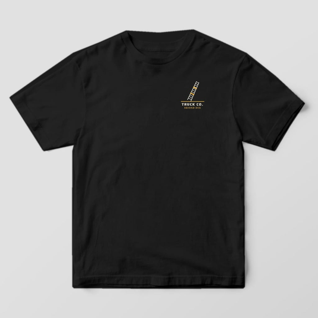 Front of a black Comfort Colors tee with a small ladder and Truck Co. stencil text on the left chest