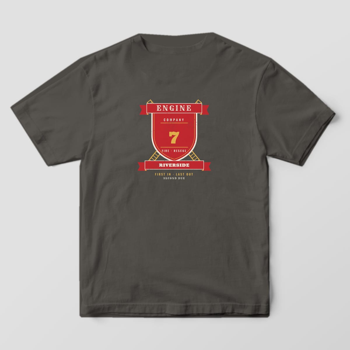 Back of a pepper Comfort Colors tee with a personalized Engine company shield, crossed ladders, number 7 and Riverside banner