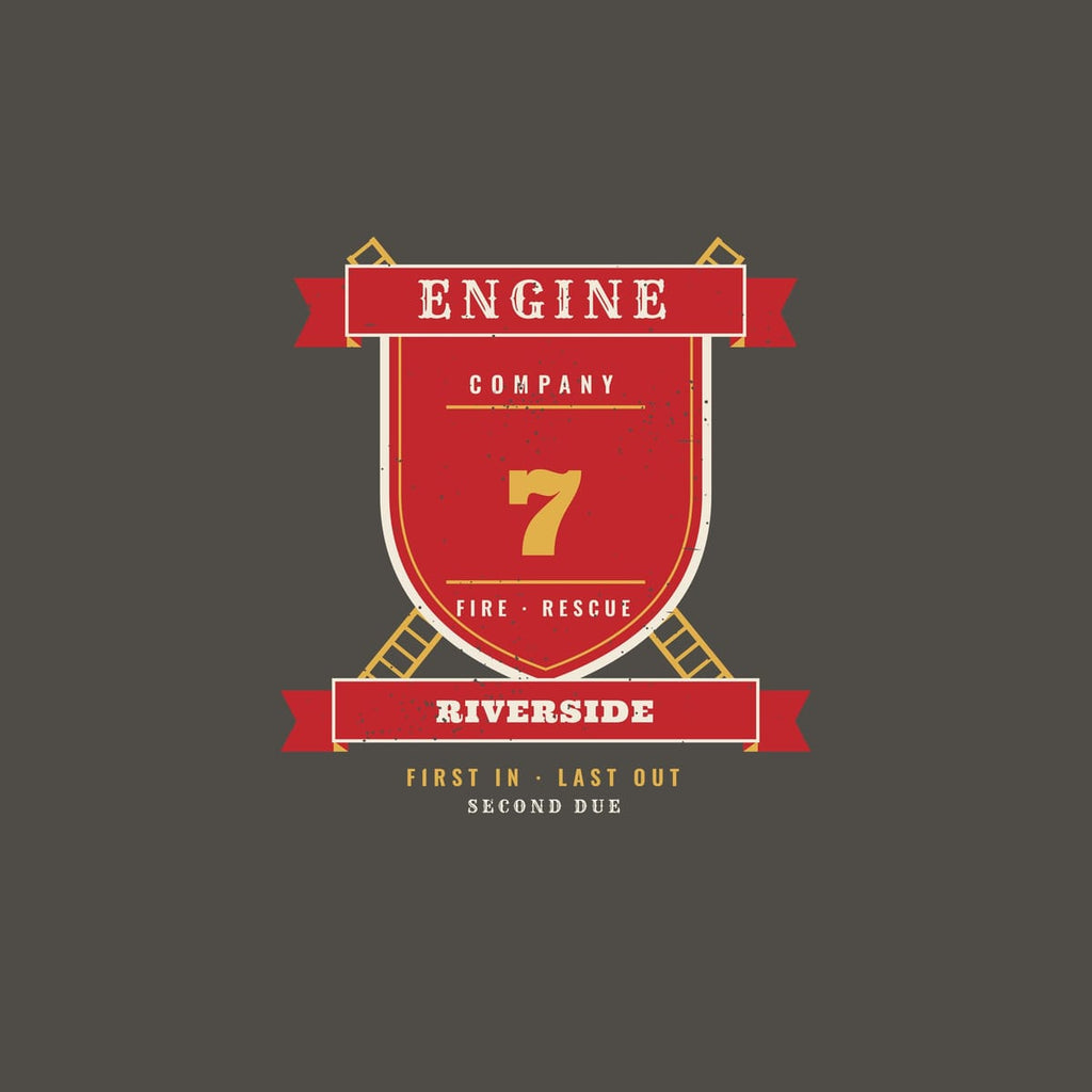 Close-up of the engine company crest showing the shield, ladders, banners and sample number and city
