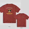 Brick red tee with a steaming chili pot, gold first place rosette and Champion on the back, small chili pot on the front chest