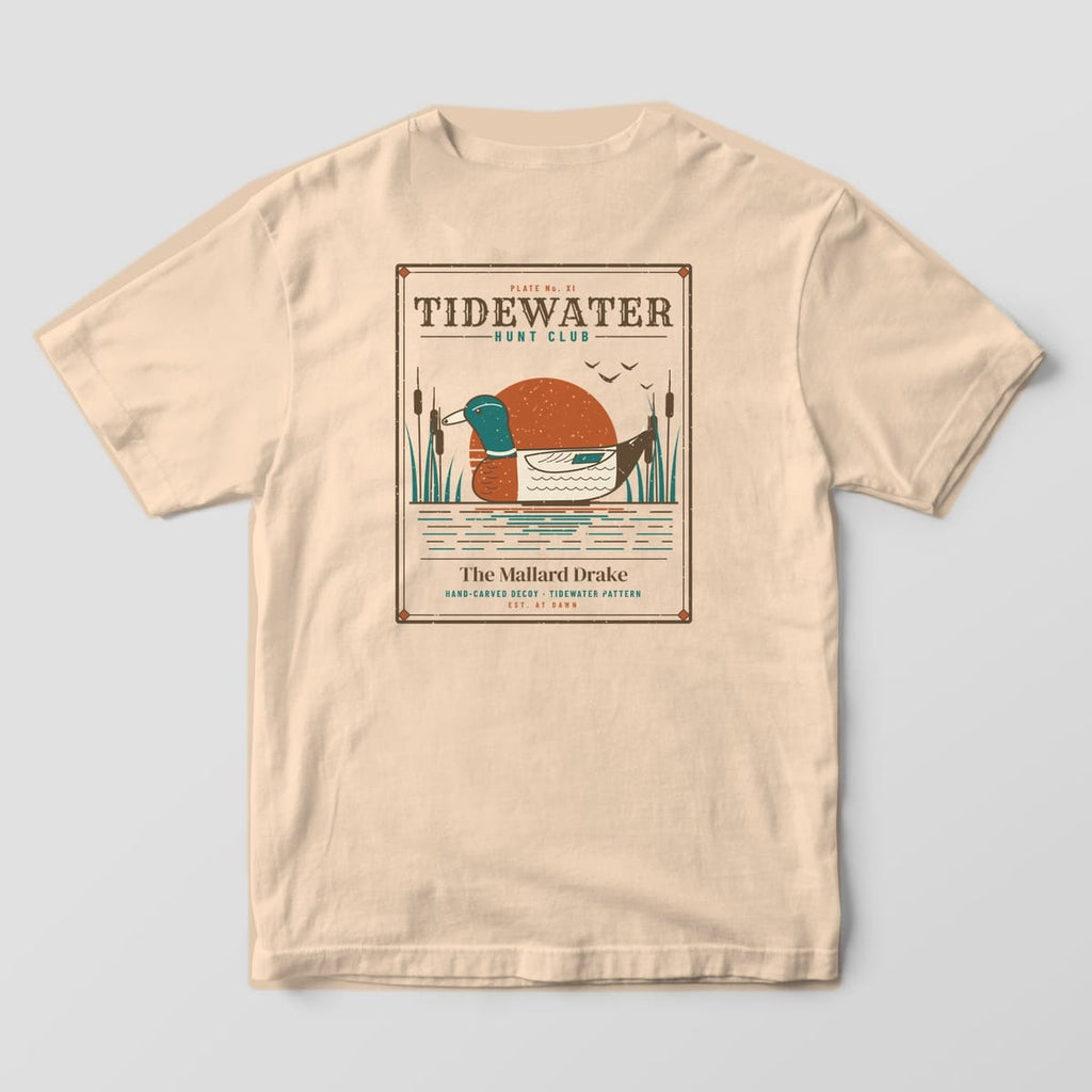 Back print on a Ivory Comfort Colors 1717 tee: Sporting-plate frame with "Tidewater Hunt Club" headline, a carved mallard drake decoy over a rust sun with cattails and water, captioned "The Mallard Drake, Hand-Carved Decoy, Est. at Dawn"
