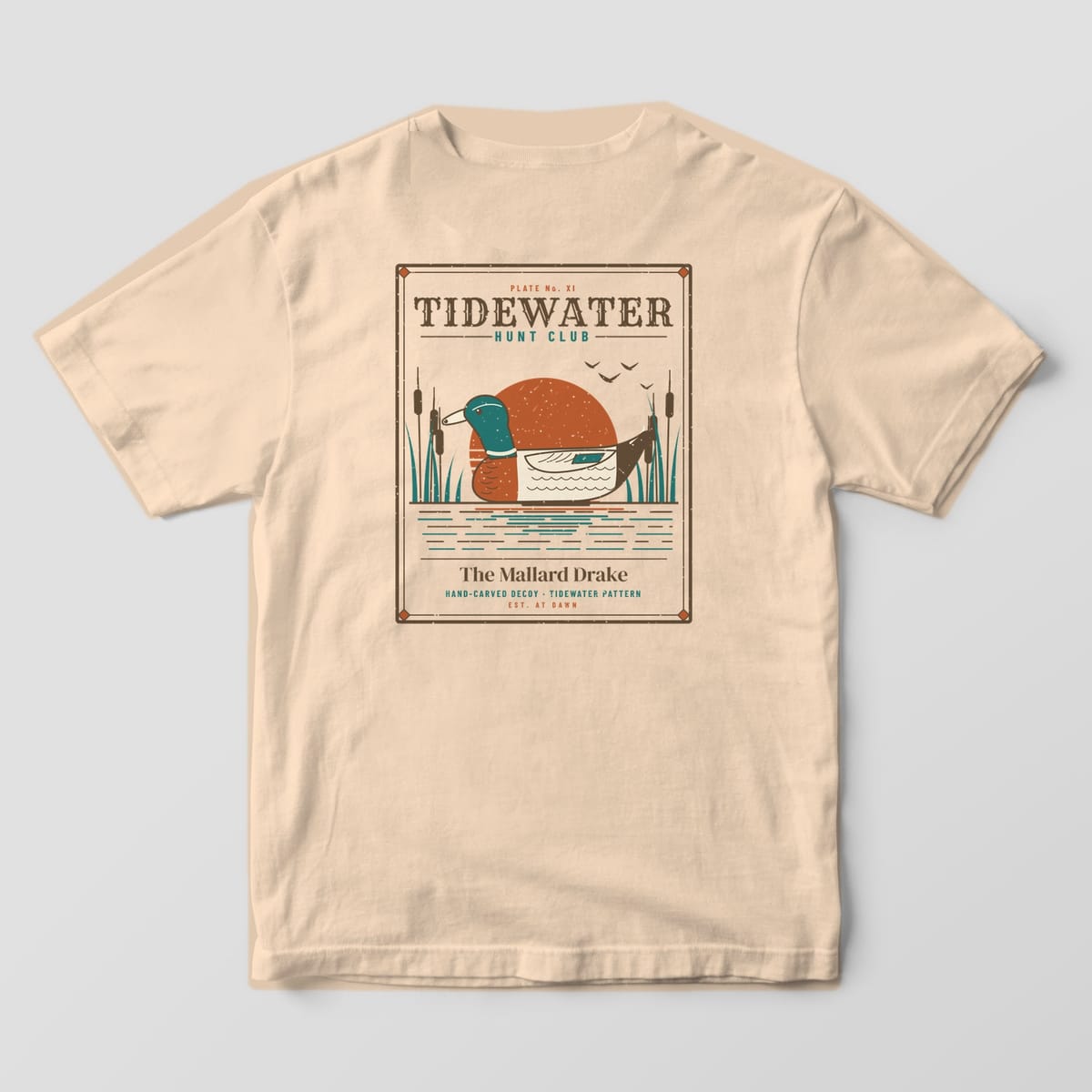 Back print on a Ivory Comfort Colors 1717 tee: Sporting-plate frame with "Tidewater Hunt Club" headline, a carved mallard drake decoy over a rust sun with cattails and water, captioned "The Mallard Drake, Hand-Carved Decoy, Est. at Dawn"