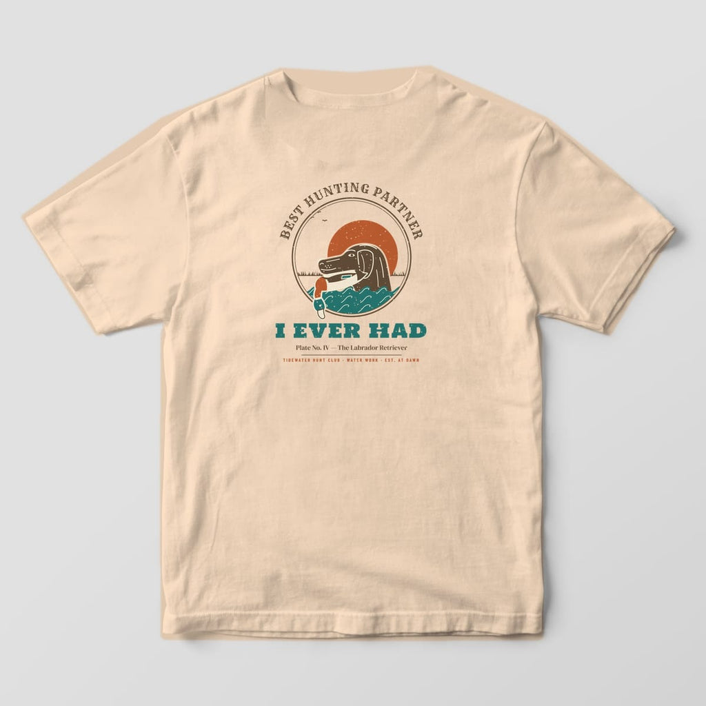 Back print on a Ivory Comfort Colors 1717 tee: Round plate of a chocolate Labrador retrieving a mallard drake through curling teal waves under a rust sun, with "Best Hunting Partner" arched above and "I Ever Had" below