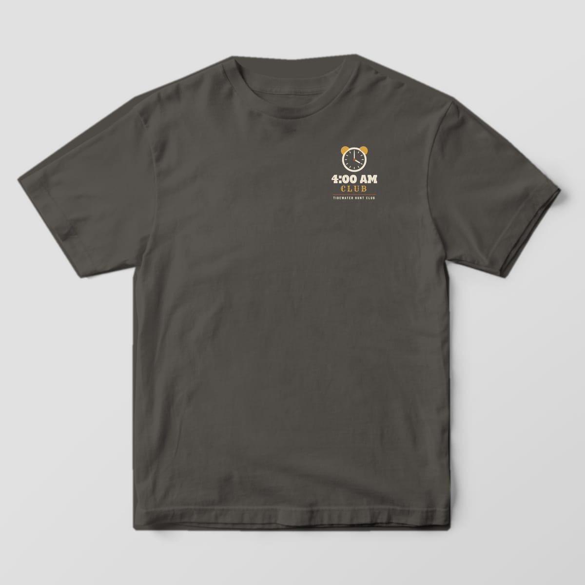 Front of the Pepper Comfort Colors 1717 tee showing the left-chest print: Left-chest "4:00 AM Club" mark with a small alarm clock and "Tidewater Hunt Club"