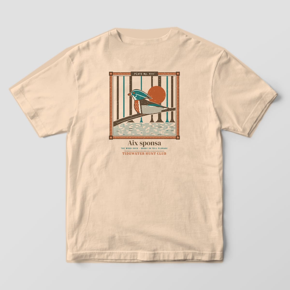 Back print on a Ivory Comfort Colors 1717 tee: Beaded frame labeled "Plate No. VIII" around a wood duck drake perched on a log in flooded cypress timber with a rust sun, captioned "Aix sponsa, The Wood Duck" and "Tidewater Hunt Club"