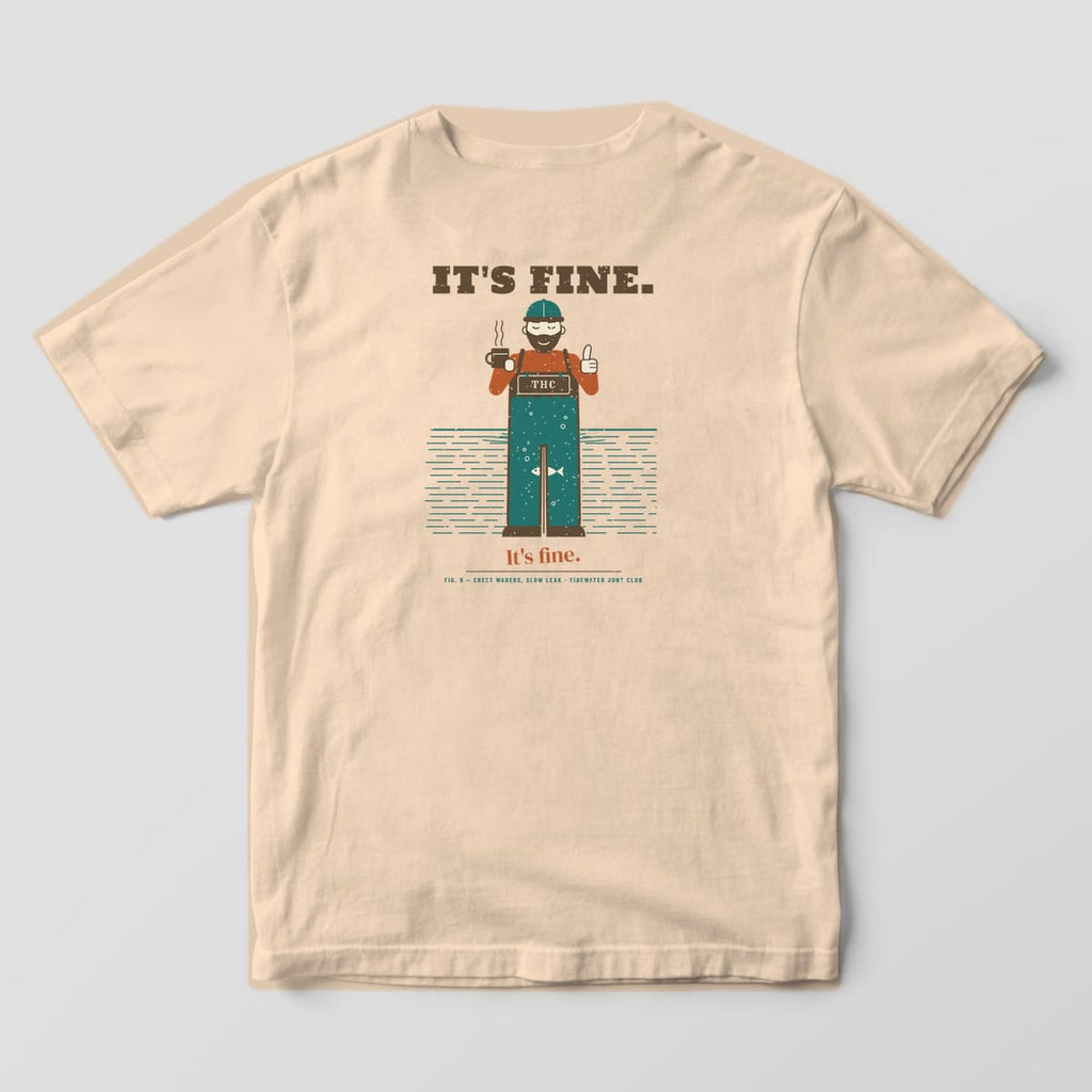 Back print on a Ivory Comfort Colors 1717 tee: "It's Fine." over a calm bearded hunter giving a thumbs up with a coffee mug, standing in the marsh while a cutaway shows his waders full of water with a fish inside, then a smaller "It's fine."