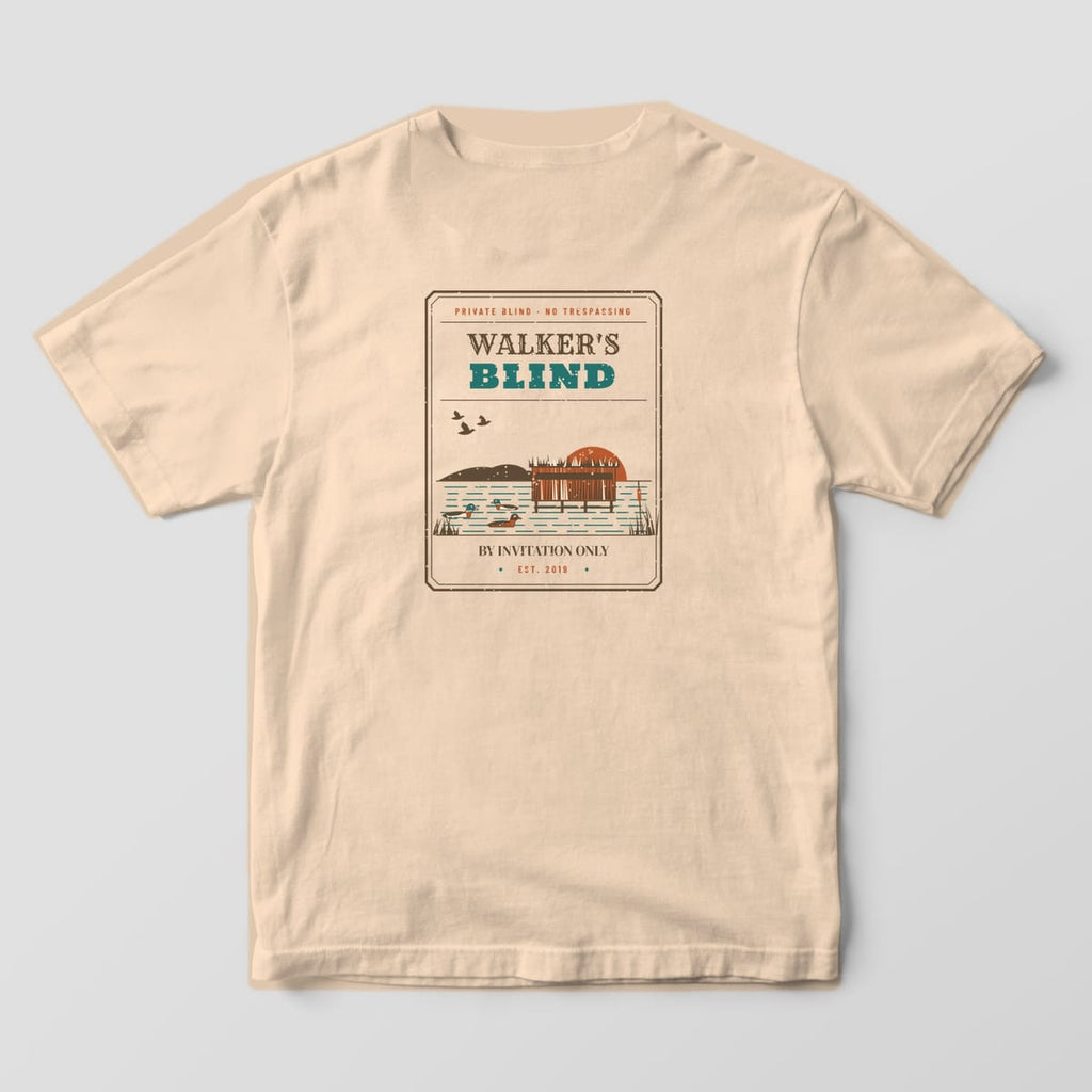 Ivory Comfort Colors T-shirt back with a vintage badge reading Walker's Blind, By Invitation Only, Est. 2019