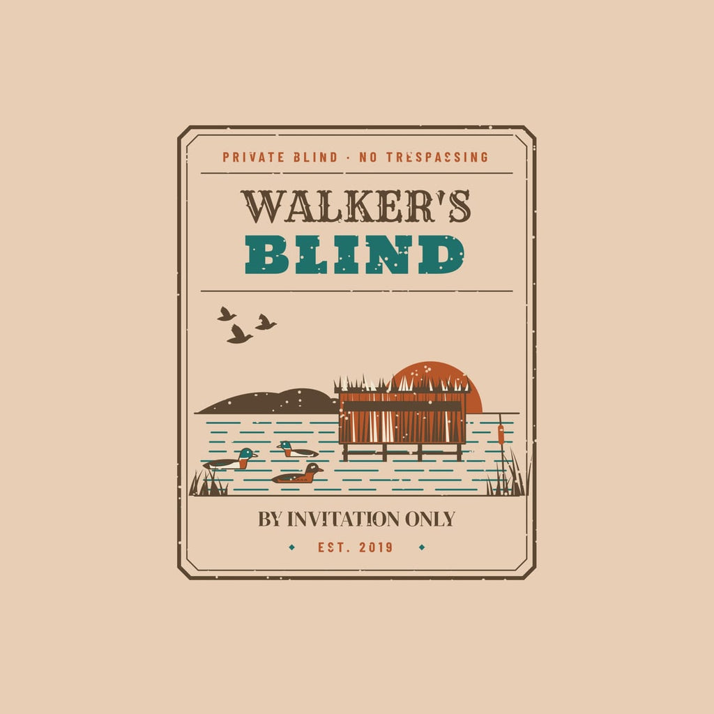 Close-up of the badge artwork showing the sample name, brushed blind on stilts, decoys and cattails