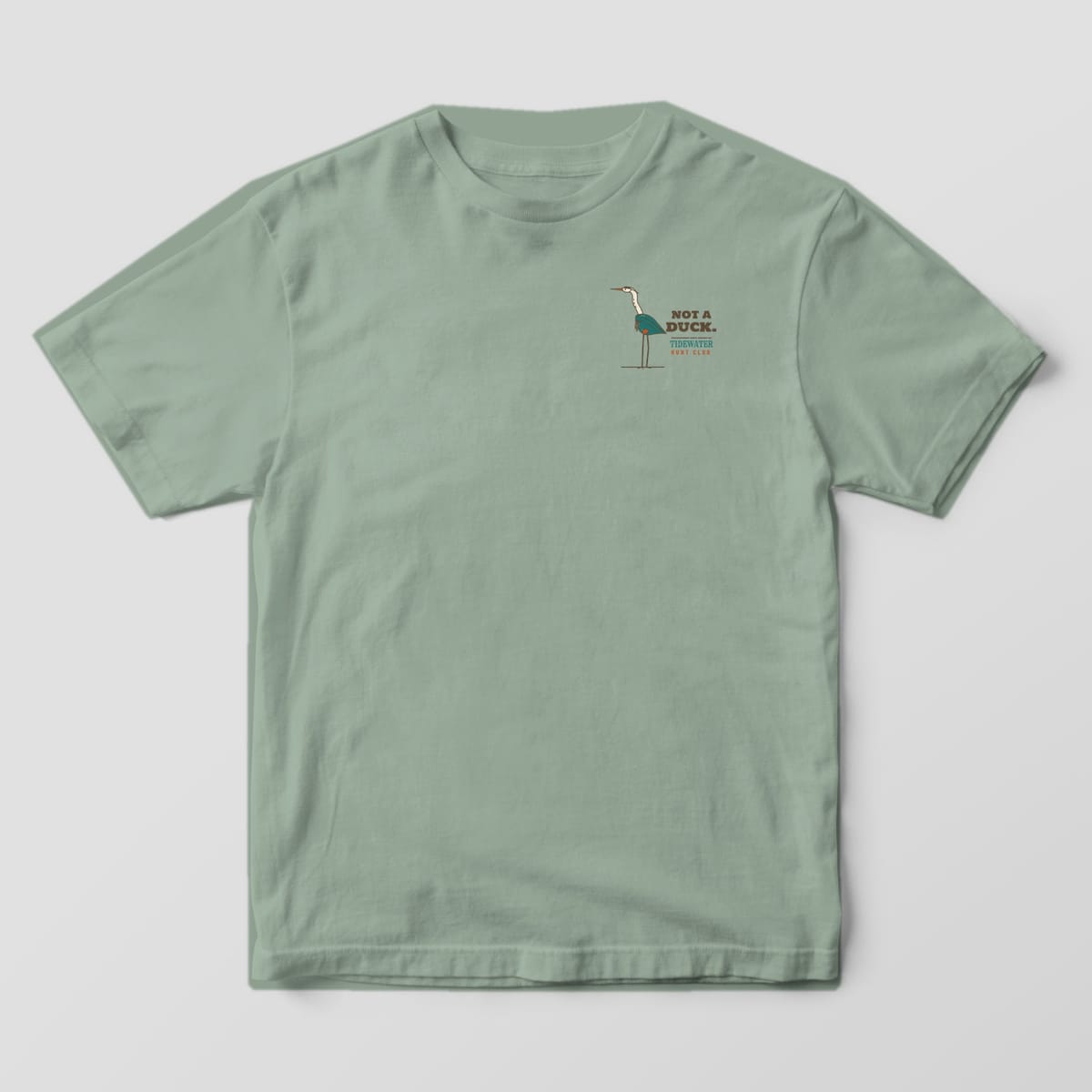 Sage Bay Comfort Colors T-shirt front with a small standing heron and Not a Duck text on the left chest