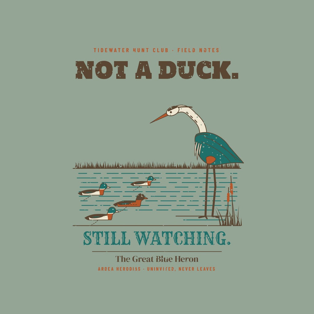 Close-up of the back artwork: teal-blue heron, cattails, decoys with anchor lines and Still Watching lettering