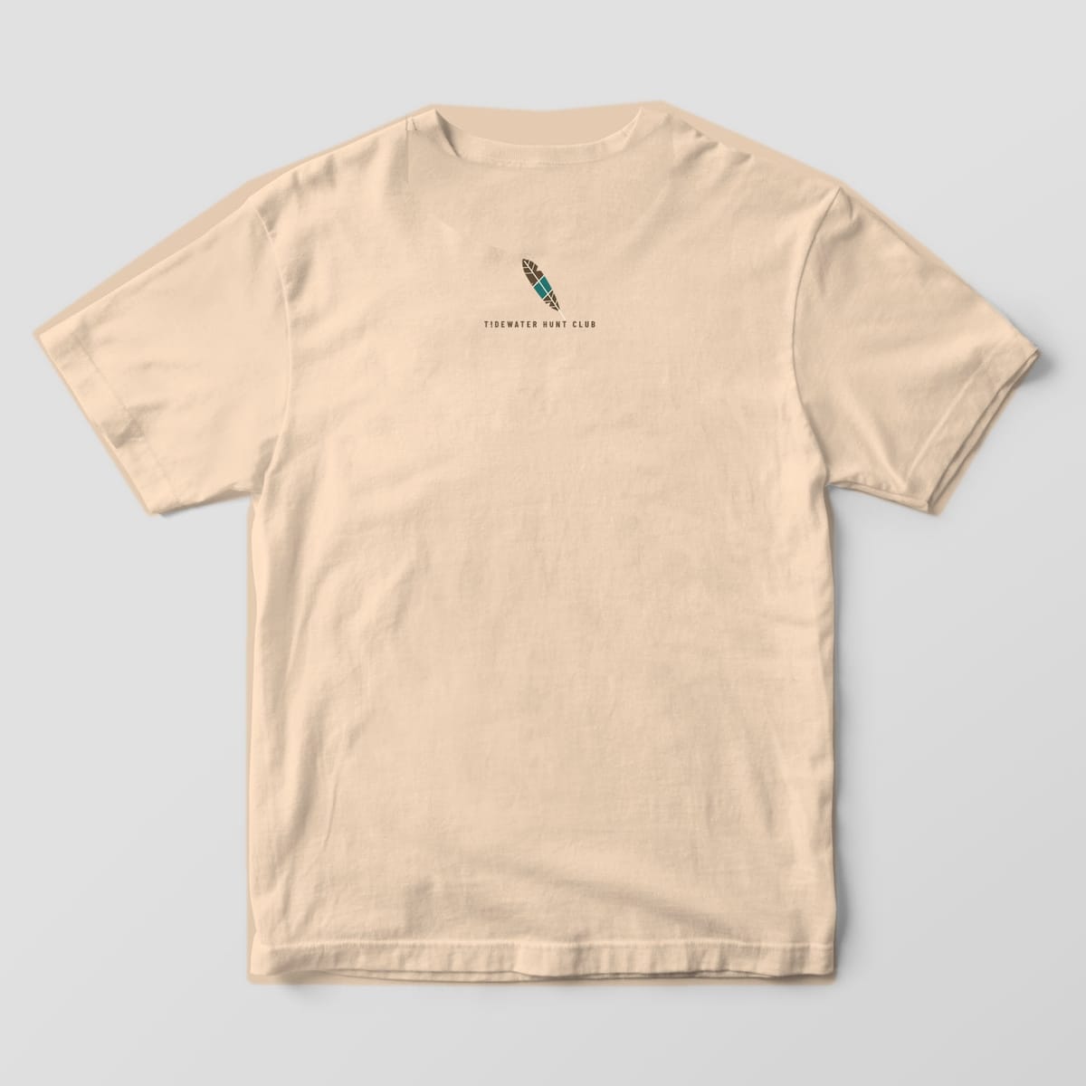 Ivory Comfort Colors T-shirt back with a small mallard feather and Tidewater Hunt Club text below the collar