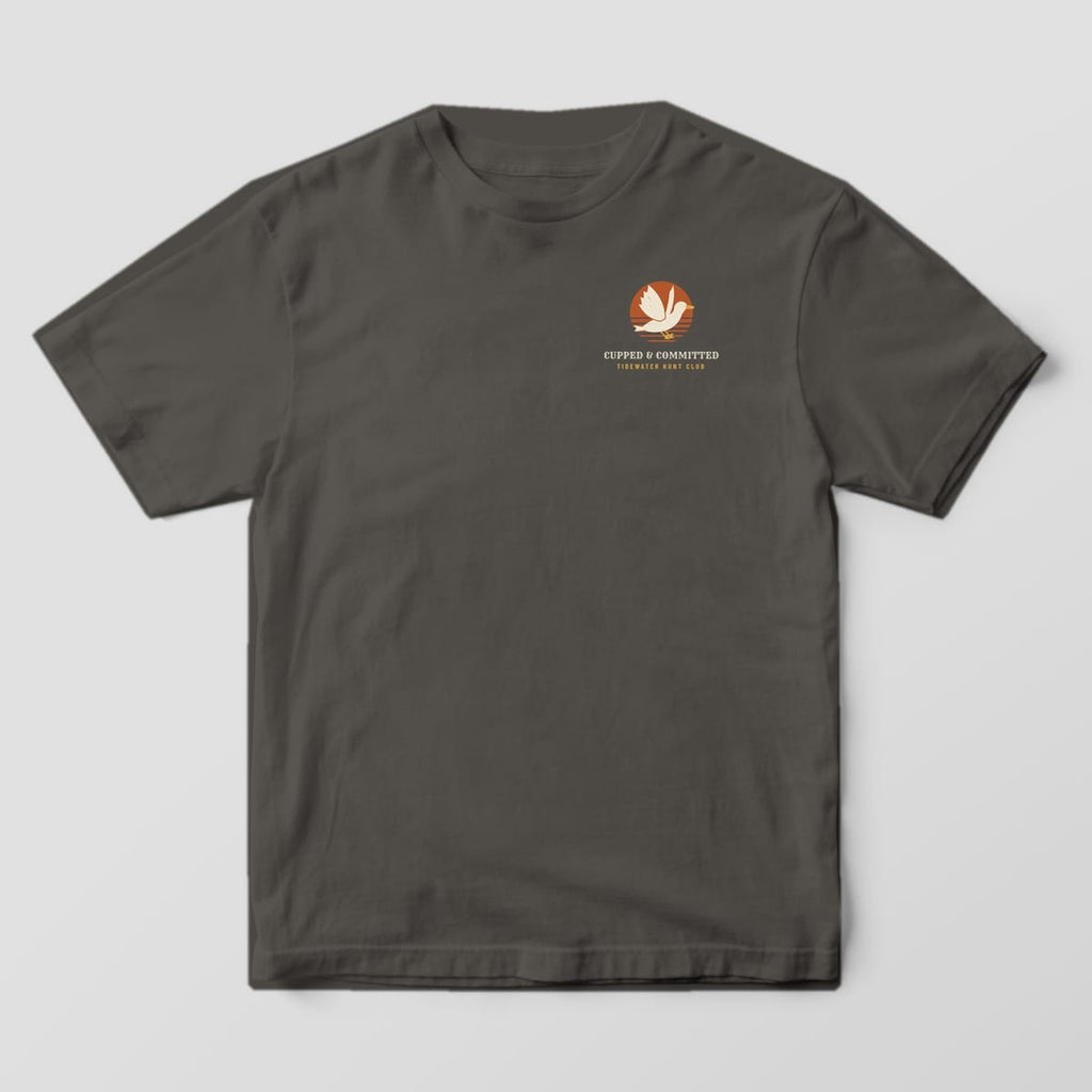 Front of the Pepper Comfort Colors 1717 tee showing the left-chest print: Left-chest mark with a cupped mallard over a small rust sun, "Cupped & Committed" and "Tidewater Hunt Club"