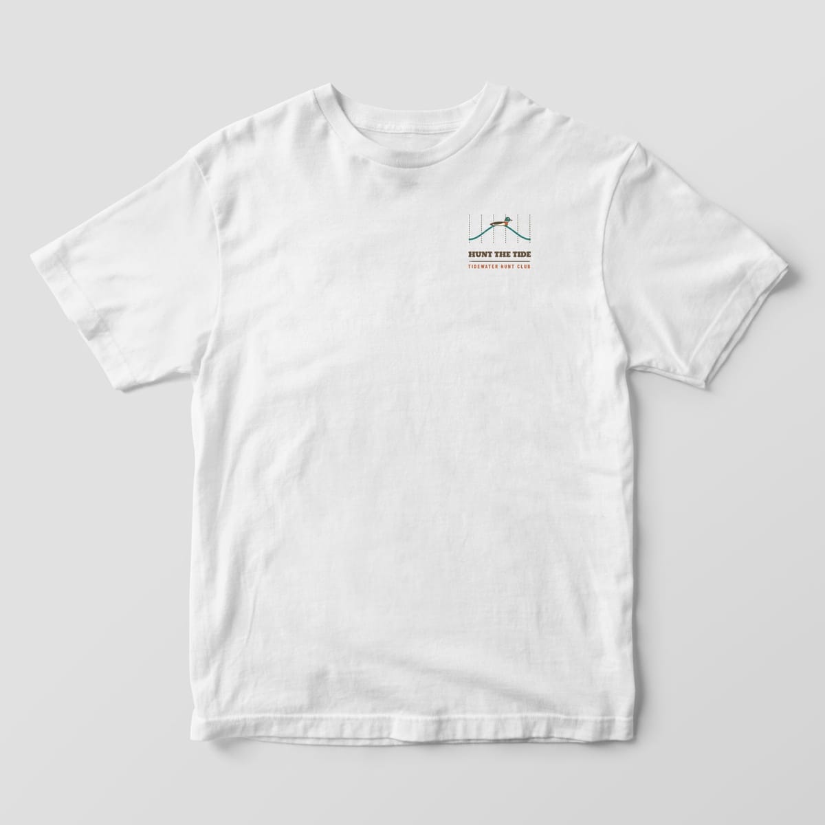 White Comfort Colors T-shirt front with a wave line, a small mallard and Hunt the Tide on the left chest