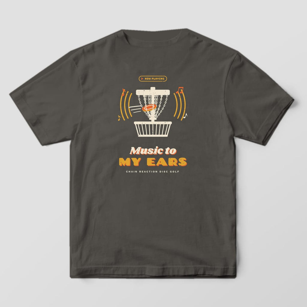 Back of a Pepper Comfort Colors 1717 tee printed with a cream disc golf basket with a disc hitting the chains, mustard sound waves and music notes, and the words Music to My Ears.