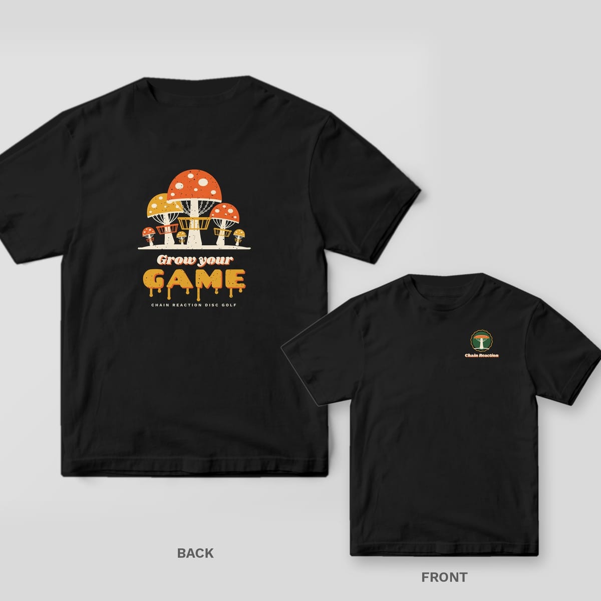 Black Comfort Colors tee shown back and front: orange and mustard spotted mushrooms built like disc golf baskets above the words Grow your GAME in melting letters on the back and a small left-chest print.