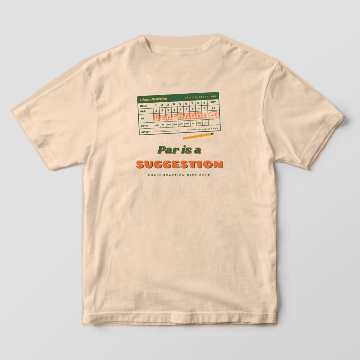Back of an Ivory Comfort Colors 1717 tee printed with a tilted retro disc golf scorecard full of boxed bogeys and a +18 total above the words Par is a Suggestion.