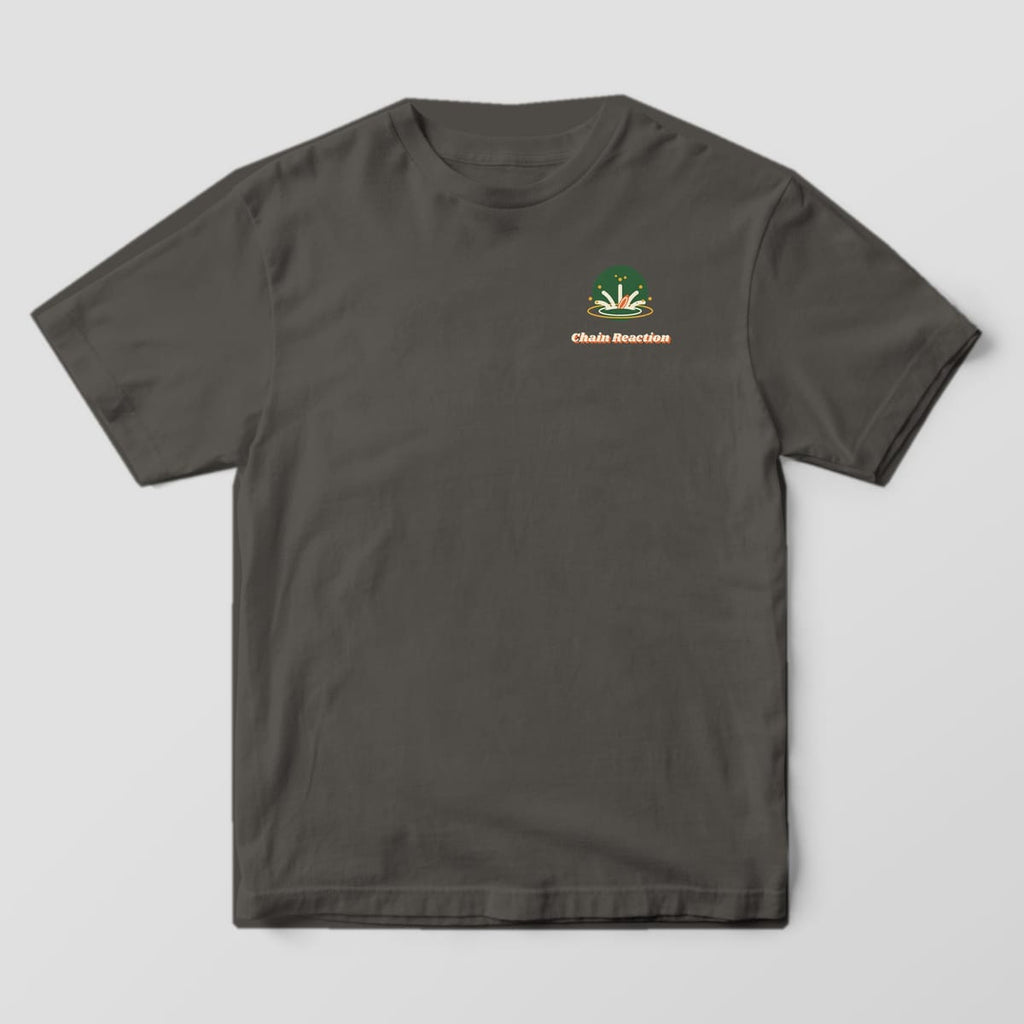 Front of a Pepper Comfort Colors 1717 tee with a small water splash icon with a sinking disc and the Chain Reaction wordmark on the left chest.