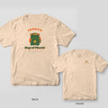 Ivory Comfort Colors tee shown back and front: a custom name arched over a green disc golf backpack stuffed with orange and mustard discs above the words Bag of Plastic on the back and a small left-chest print.
