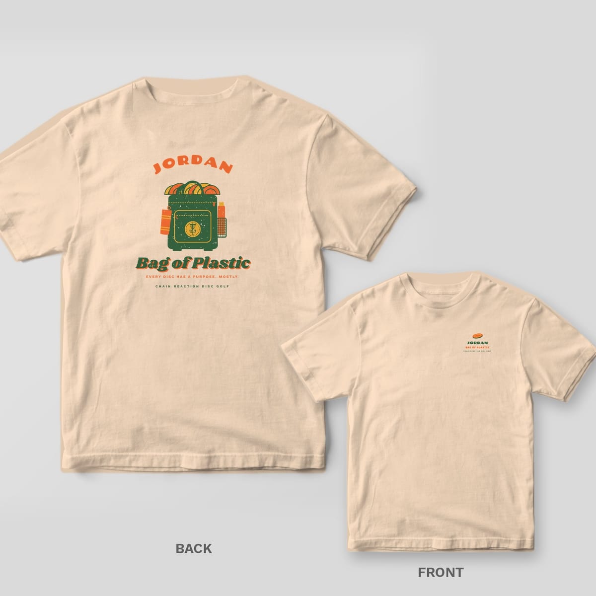 Ivory Comfort Colors tee shown back and front: a custom name arched over a green disc golf backpack stuffed with orange and mustard discs above the words Bag of Plastic on the back and a small left-chest print.