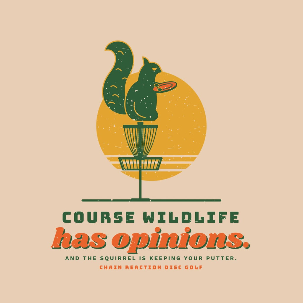 Close-up of the print: squirrel holding a disc on a basket, retro sun, Course Wildlife has opinions lettering