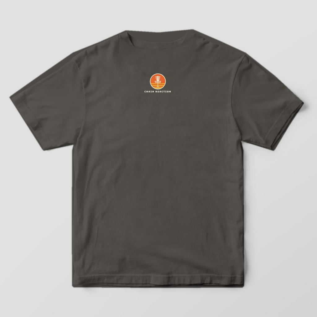 Back of a pepper Comfort Colors t-shirt with a small orange sunset basket badge under the collar