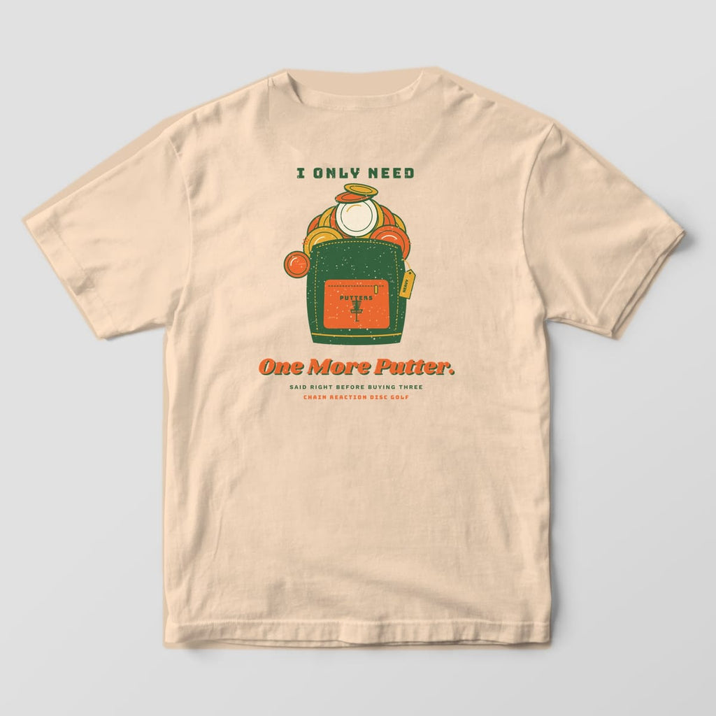 Back of an ivory Comfort Colors t-shirt with an overflowing disc golf bag and the words I Only Need One More Putter
