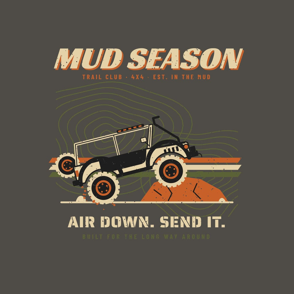 Close-up of the back print artwork, Mud Season wordmark, lifted 4x4 on a rock ledge over topo lines and racing stripes, Air Down Send It text, on a pepper background