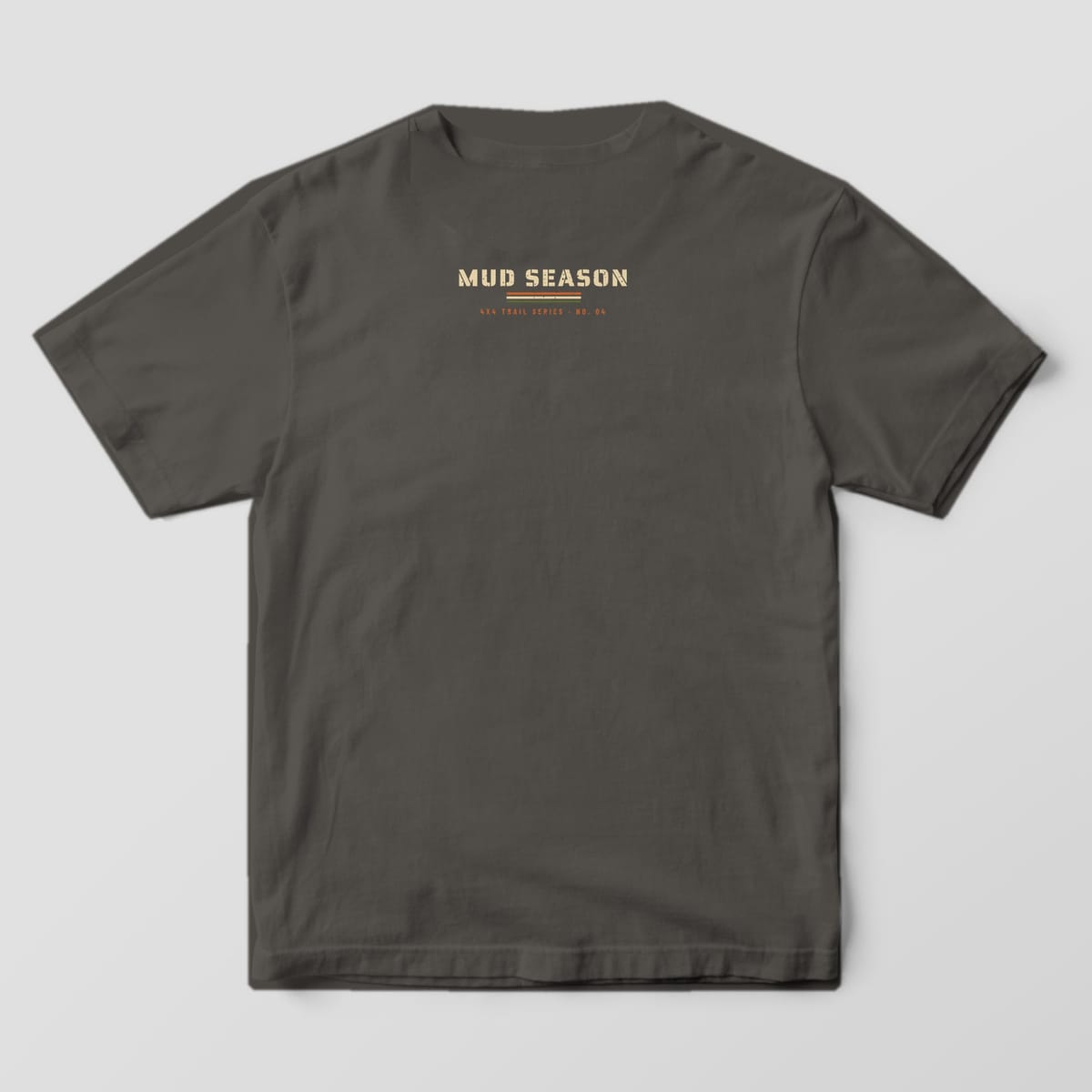 Back of a Pepper Comfort Colors 1717 tee with a small stencil Mud Season logo under the collar
