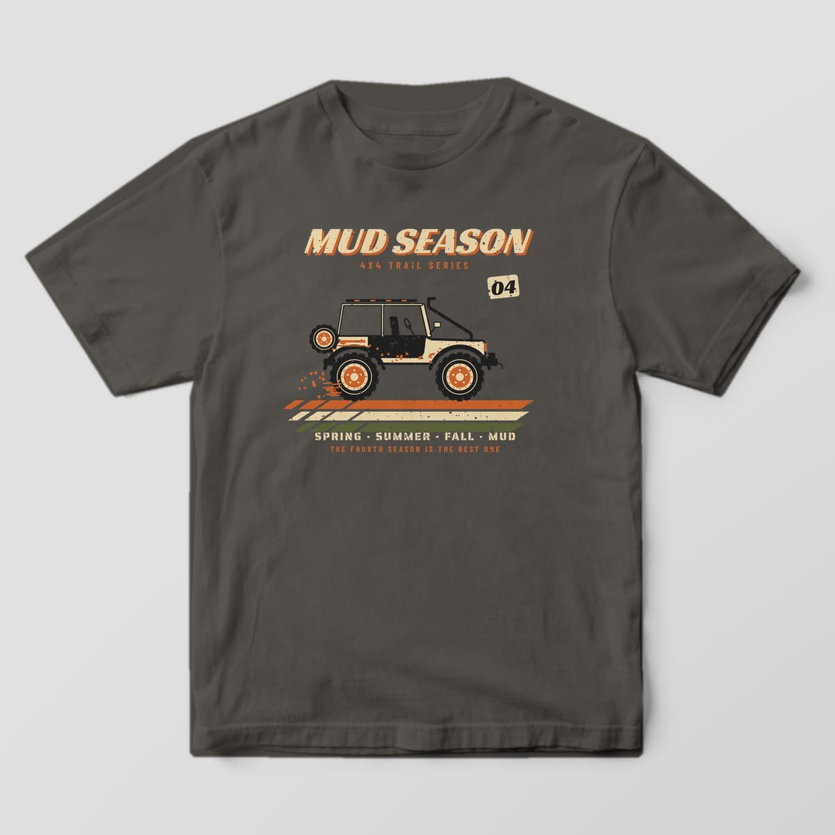 Front of a Pepper Comfort Colors 1717 tee with a full front Mud Season racing wordmark with a lifted 4x4 on retro racing stripes and Spring Summer Fall Mud text